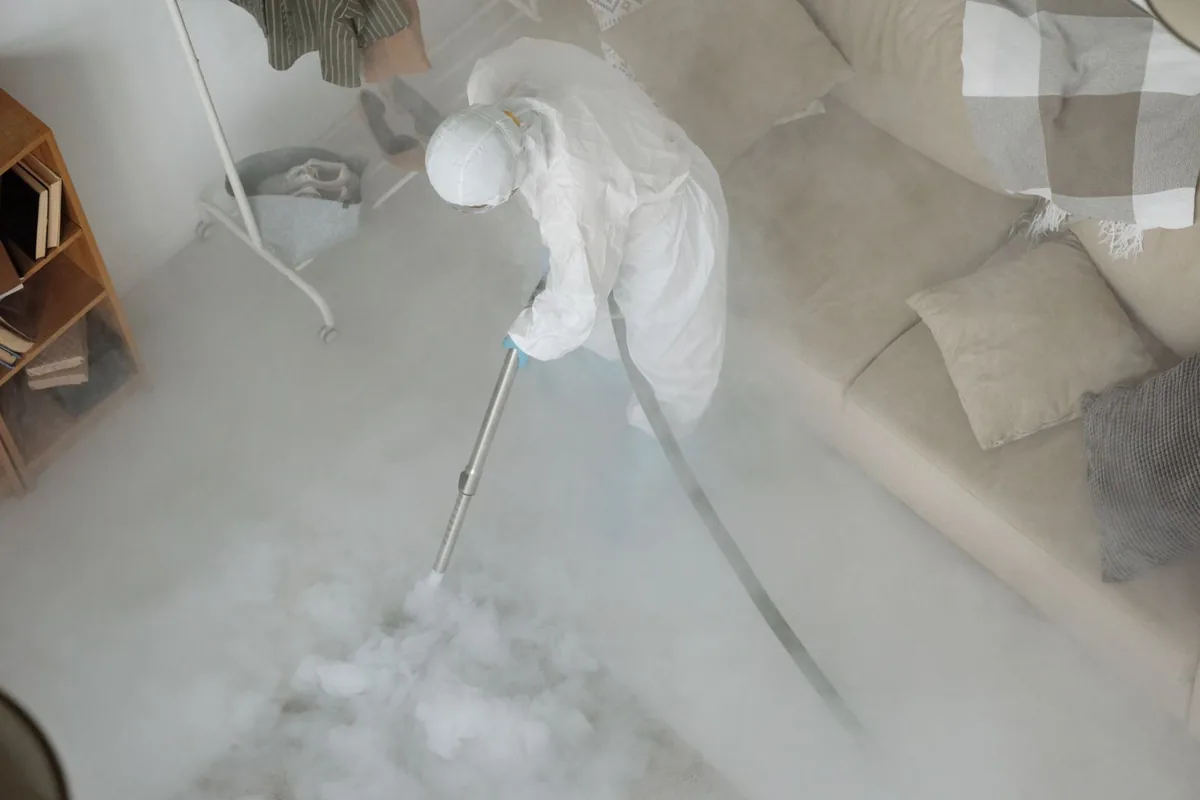 Biohazard cleanup technician in protective equipment, Terra Alta, WV